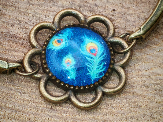 Bracelet bronze avec cabochon motif plumes de paon
