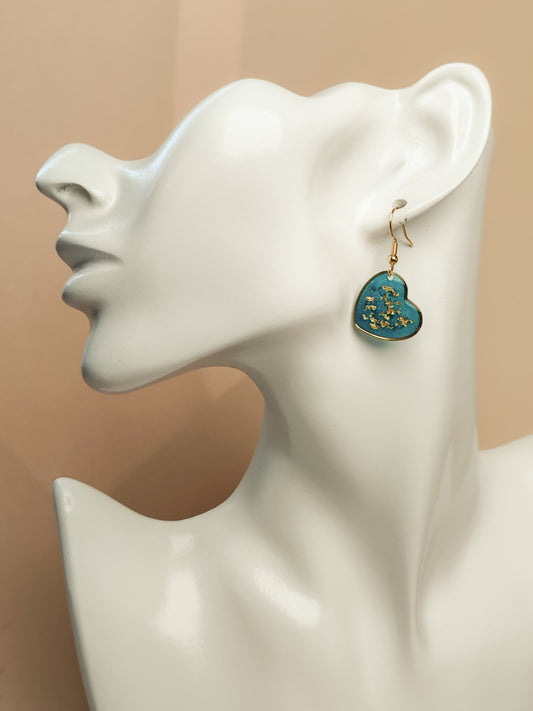 Boucles d’oreilles – Cœurs lumineux bleu turquoise aux éclats dorés