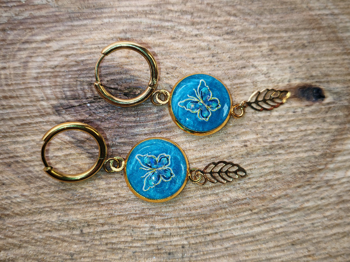 Boucles d’oreilles – Papillon et feuille en lumière