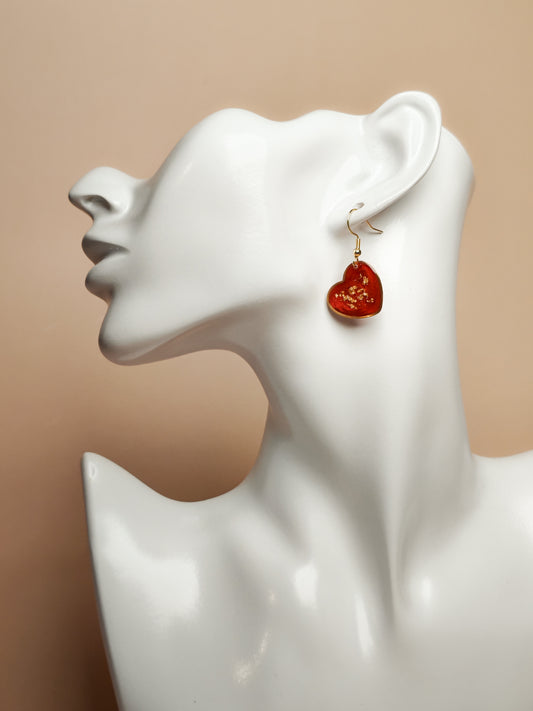 Boucles d’oreilles – Cœurs rouges lumineux aux éclats dorés