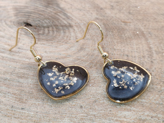 Boucles d’oreilles – Cœurs lumineux noirs aux éclats dorés