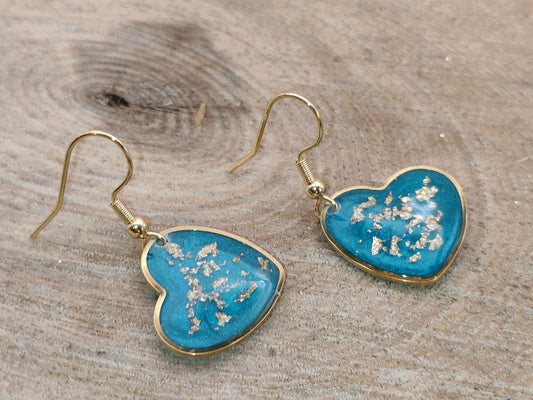 Boucles d’oreilles – Cœurs lumineux bleu turquoise aux éclats dorés