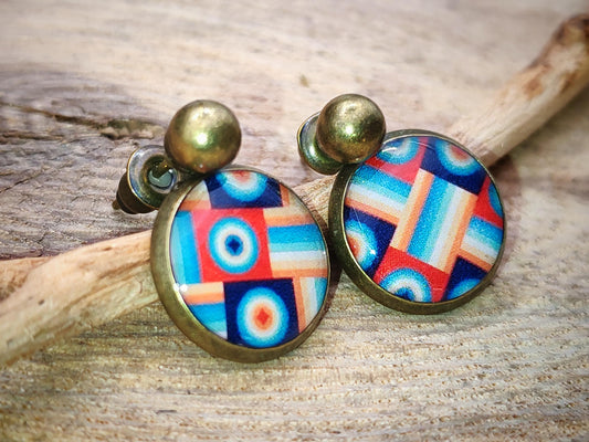 Puce d'oreille de 12mm de diamètre en résine sur imprimé, motif asymétrique, fait main